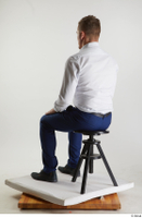  Steve Q  1 black oxford shoes blue trousers business dressed sitting white shirt whole body 0002.jpg